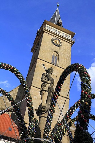 Easter fountains, market well, with the statue of Count Albrecht III von Hohenlohe, Blasturm Tower of the St. Peter and Paul abbey church, market square, Oehringen, Hohenlohe, Baden-Wuerttemberg, Germany, Europe