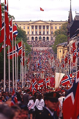 Main street Karl Johan with flags and people in front of the royal palace, celebration of the National day, May 17, Oslo, Norway, Europe