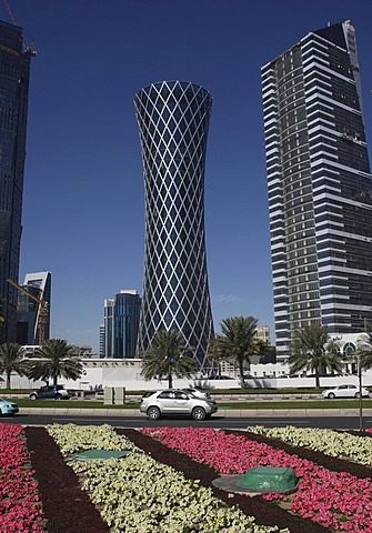 Tornado Tower skyscraper and flower beds along the roadside, West Bay District, Doha, Qatar, Middle East