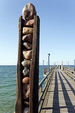 Abstract sculpture on a pier, made of stone and wood by Roland Lindner, Zingst, Fischland-Darss-Zingst, Baltic Sea, Mecklenburg-Western Pomerania, Germany, Europe