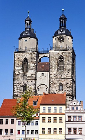 Towers of the church of St. Marien and restored houses in Lutherstadt Wittenberg, Saxony-Anhalt, Germany, Europe