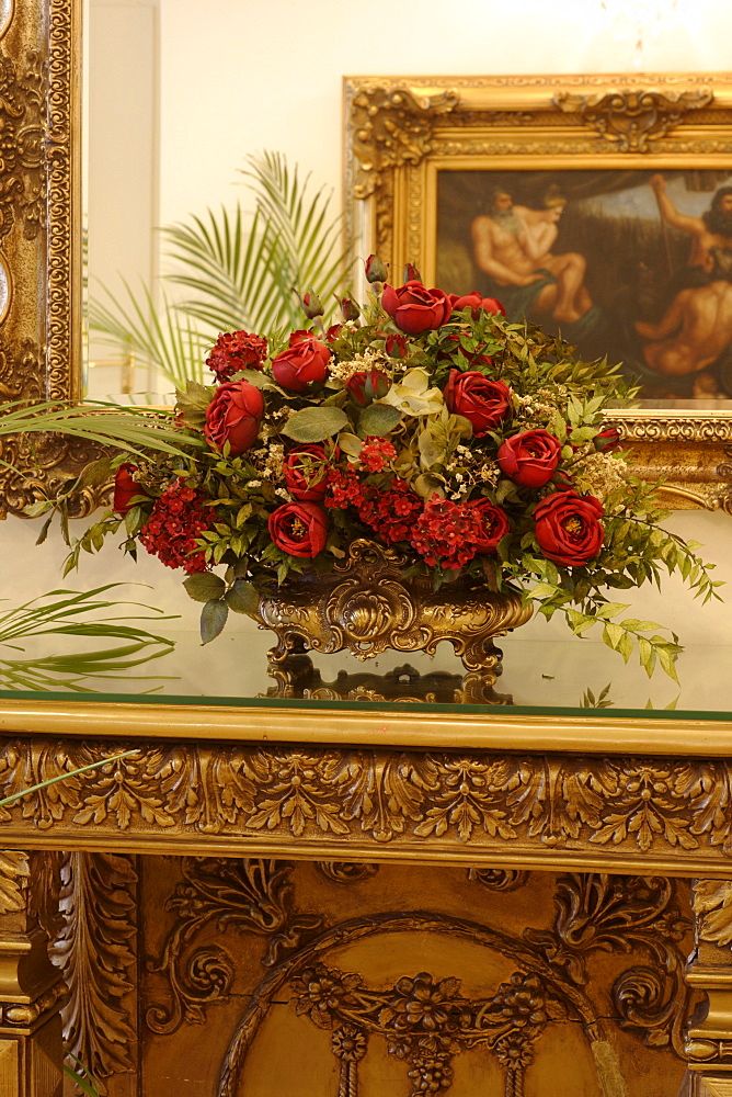 Rose bouquet on a small table, antique decoration