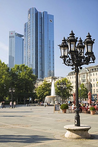 Candelabra-style street lantern at Frankfurt Opera House looking towards the twin towers of Deutsche Bank, Frankfurt, Hesse, Germany, Europe