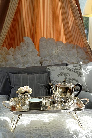 Silver breakfast tray in a canopy bed, Villa & Ambiente, Im Weller 28, Nuremberg, Middle Franconia, Bavaria Germany, Europe