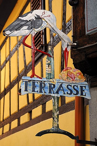 Restaurant sign with a stork on a set table, 44 Rue des Potiers Kaysersberg, Alsace, France, Europe