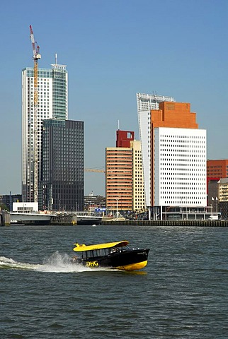 Small watertaxi ferry boat on the Nieuwe Maas River, modern architecture at the Wilhelminapier at back, Rotterdam, Zuid-Holland, South-Holland, Netherlands, Europe