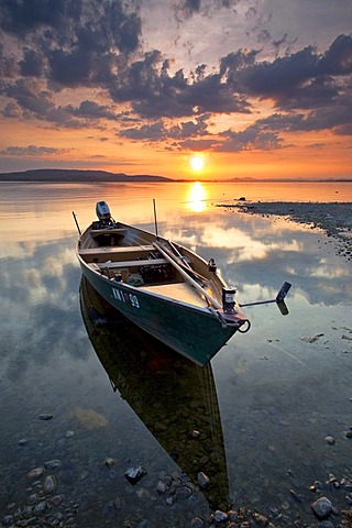 Fishing boat on Lake Constance at dusk with reflections, Reichenau, Baden-Wuerttemberg, Germany, Europe