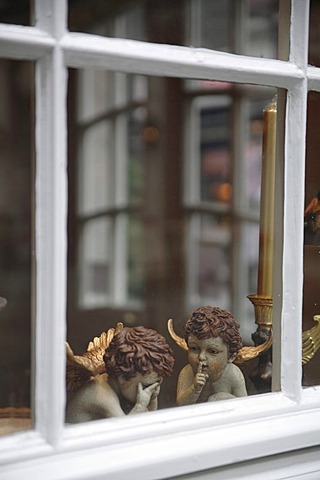 Angel figurines in a window