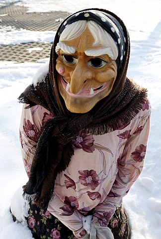 Life-size witch figure in the snow, Thale, Harz, Saxony-Anhalt, Germany, Europe