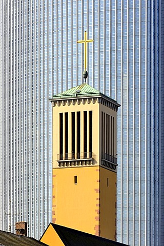 The bell tower of the Matthaeuskirche church, in the back the aluminium facade of the Pollux high rise office building in the financial district, Frankfurt am Main, Hesse, Germany, Europe