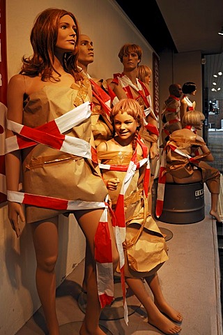 Window dummies decorated with wrapping paper and barrier tape, during a clearance sale in a sports store, Erlangen, Middle Franconia, Bavaria, Germany, Europe