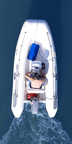 Man in a dinghy, from above