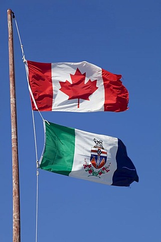 Canadian flag and Yukon territorial flag, in the wind, Yukon Territory, Canada