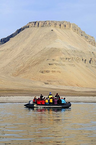 Zodiac with cruiseship passengers near the shore of Devon Island, Northwest Passage, Nunavut, Canada, Arctic