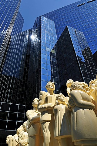 Illuminated Crowd sculpture by Raymond Masson in front of a skyscraper, downtown Montreal, Quebec, Canada, North America