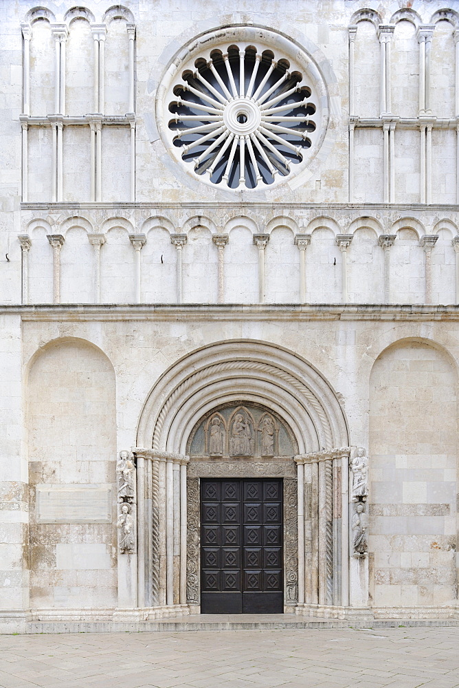 Portals and rosette on the west facade of the Cathedral of St. Anastasia in Zadar, Croatia, Europe