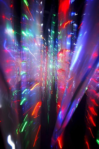 Maze, labyrinth made of colorful illuminated light rods, at a fair