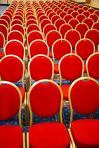 Conference room with red chairs in a row