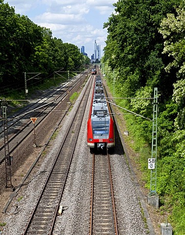 Train leaving Frankfurt, in the back the skyline of Frankfurt am Main, Hesse, Germany, Europe