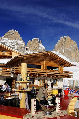 Skiers in front of the Rifugio Salei bar and restaurant, Sella Pass, Sassolungo Mountain, Sella Ronda ski trail, Val Gardena, Alto Adige, Italy, Europe