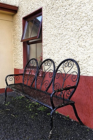 Metal frame bench seat under window, County Armagh, Northern Ireland, Europe