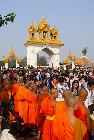 Theravada Buddhism, That Luang Festival, Tak Bat, believers, pilgrims giving alms, monks standing together, orange robes, Vientiane, Laos, Southeast Asia, Asia