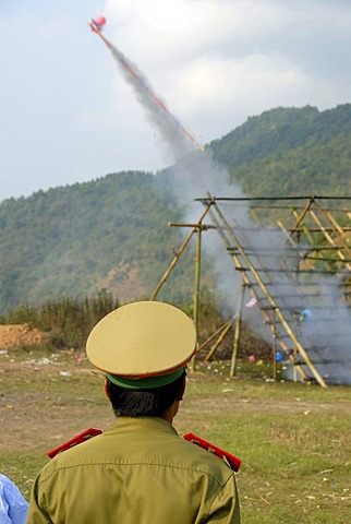 Laotian pi mai New Year festival, launch of a rocket, bang fai rocket firing, policeman with a peaked cap, Phongsali, Laos, Southeast Asia, Asia