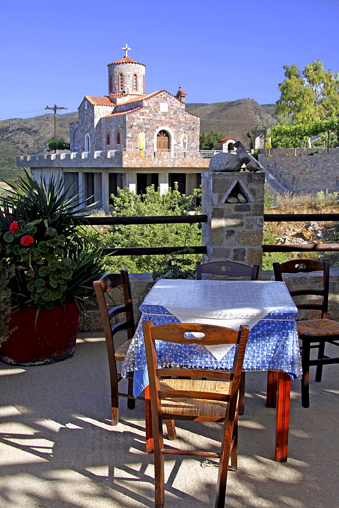 Taverna overlooking the church, mountain village of Axos, Crete, Greece, Europe