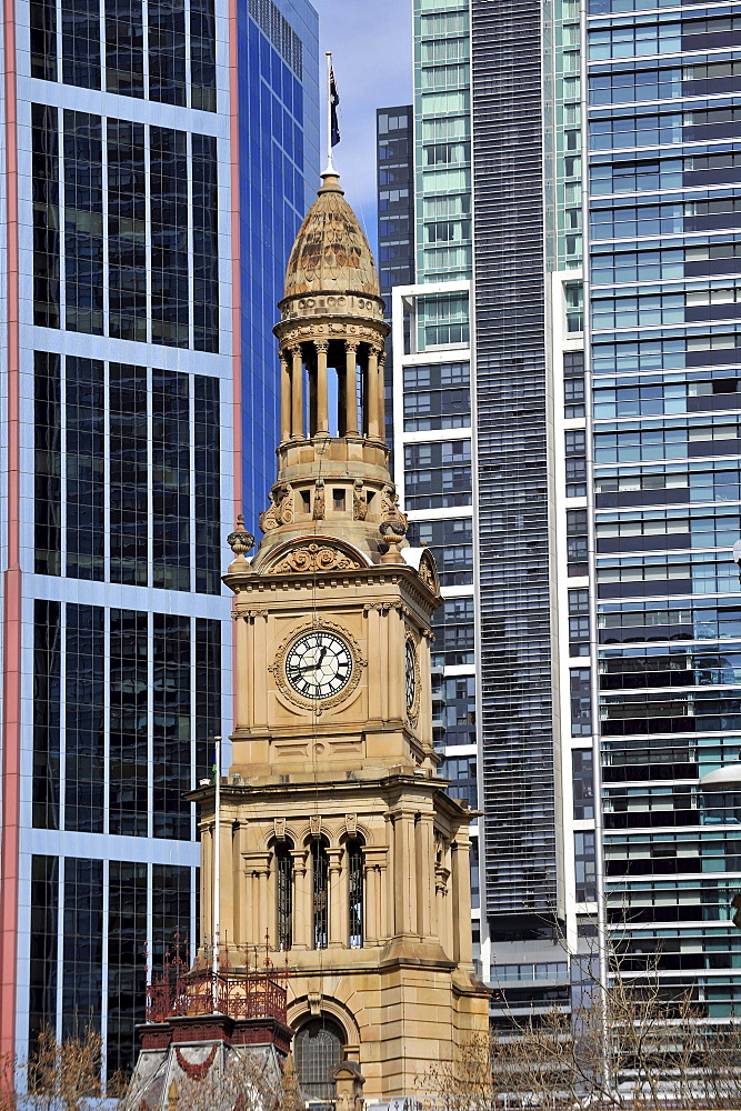 West side of Sydney Town Hall, a Victorian tower, in front of skyscrapers, Sydney, New South Wales, Australia