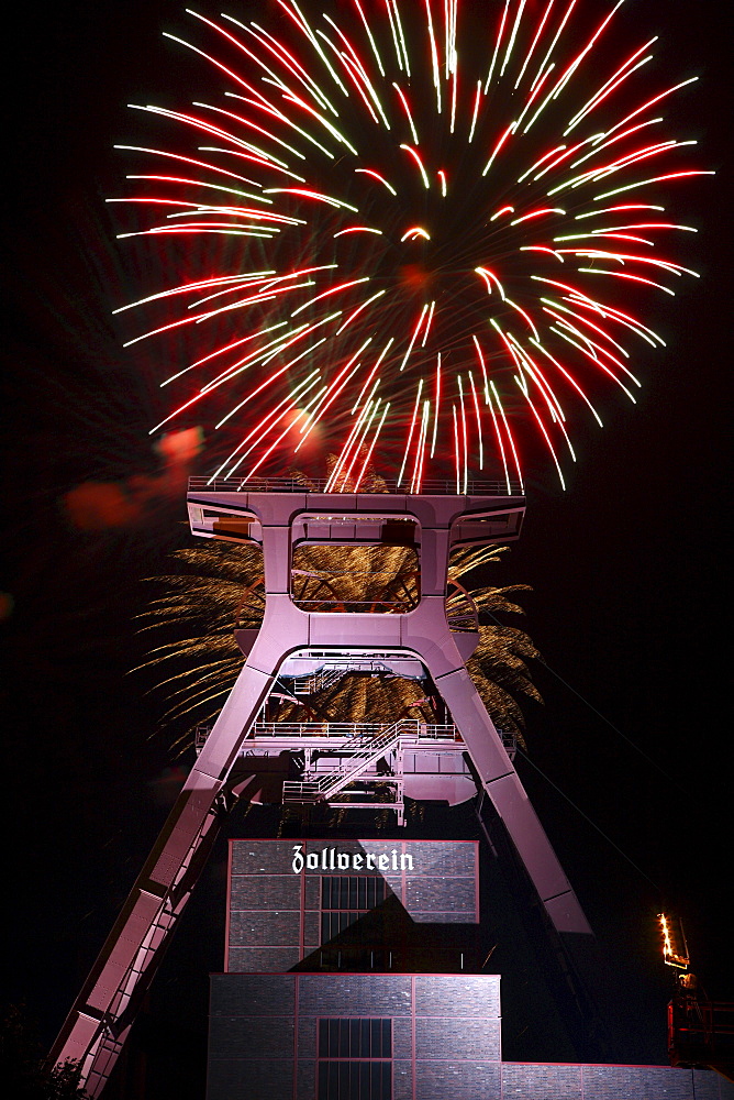 Fireworks above the headframe or winding tower of the Zollverein Coal Mine, Shaft XII, during the Zechenfest festival, World Heritage Site, Essen, North Rhine-Westphalia, Germany, Europe