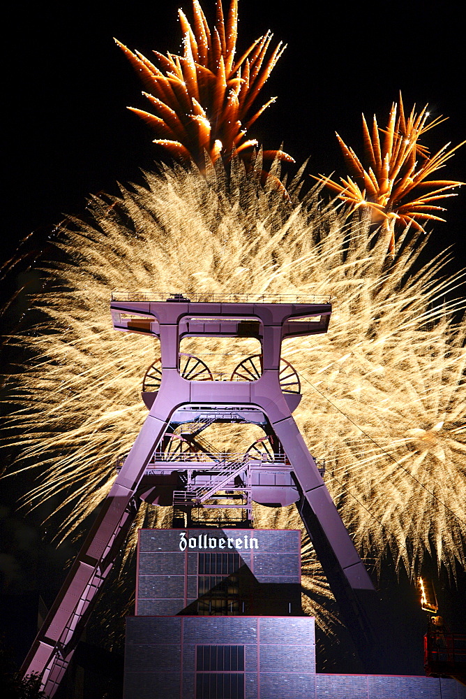 Fireworks above the headframe or winding tower of the Zollverein Coal Mine, Shaft XII, during the Zechenfest festival, World Heritage Site, Essen, North Rhine-Westphalia, Germany, Europe