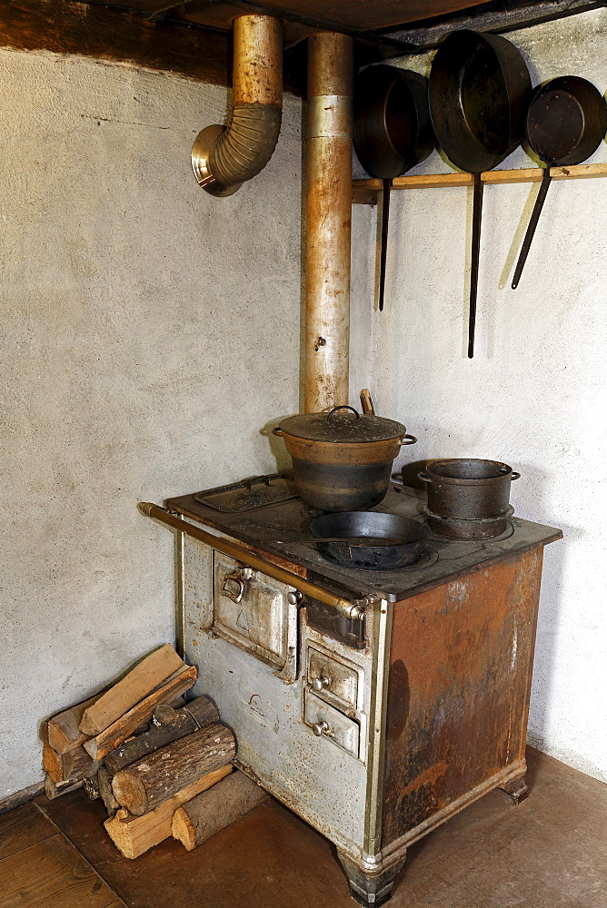 Old stove with an oven pipe, kitchen, historic bakery from 1730, Wolfegg Farmhouse Museum, Allgaeu, Upper Swabia, Baden-Wuerttemberg, Germany, Europe