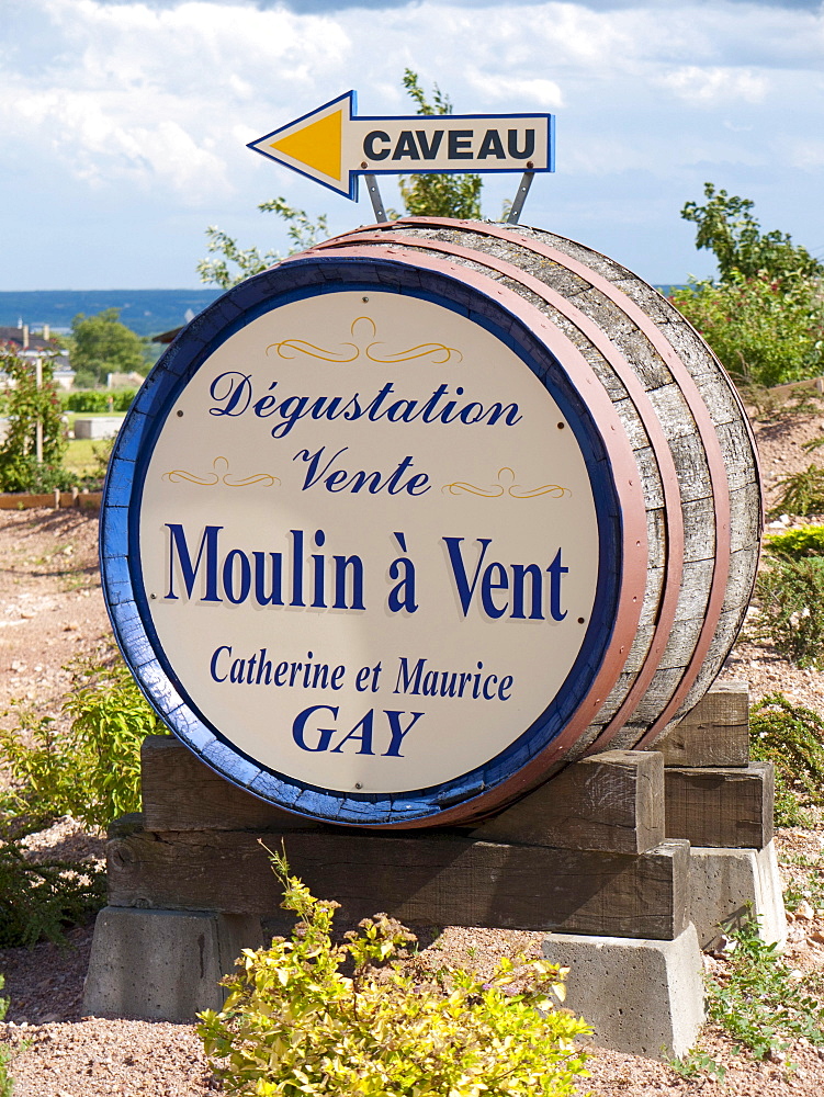 A winery in Romaneche-Thorins advertising on a wine barrel for its Beaujolais wine, Moulin a Vent, Beaujolais, Rhone departement, France, Europe