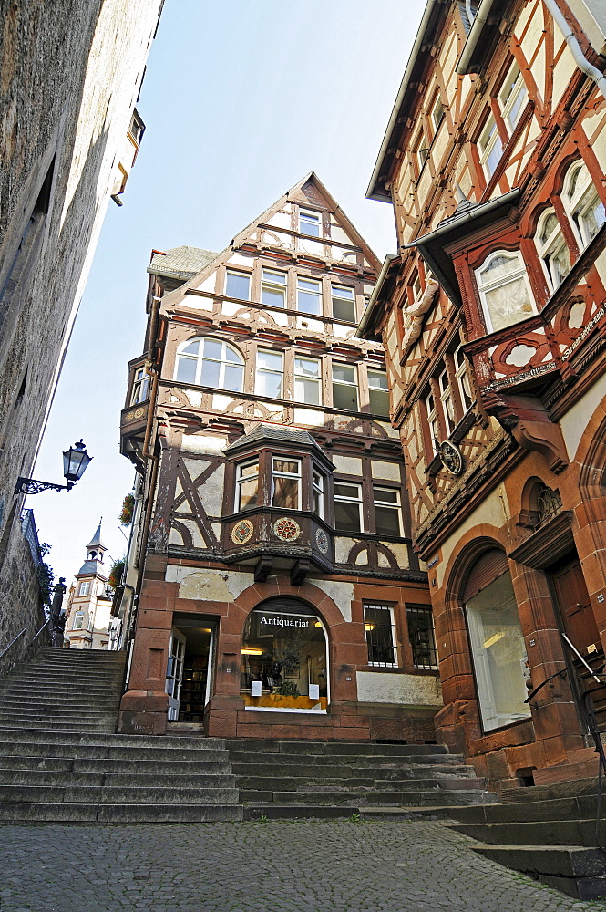 Second hand bookshop, shop for antique books, Steile Strasse street, stairs, historic half-timbered houses, historic centre, Marburg, Hesse, Germany, Europe