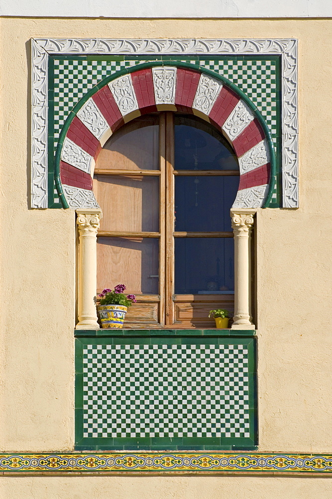 Colorful window with flower pots in the Juderia of Cordoba, Andalusia, Spain, Europe