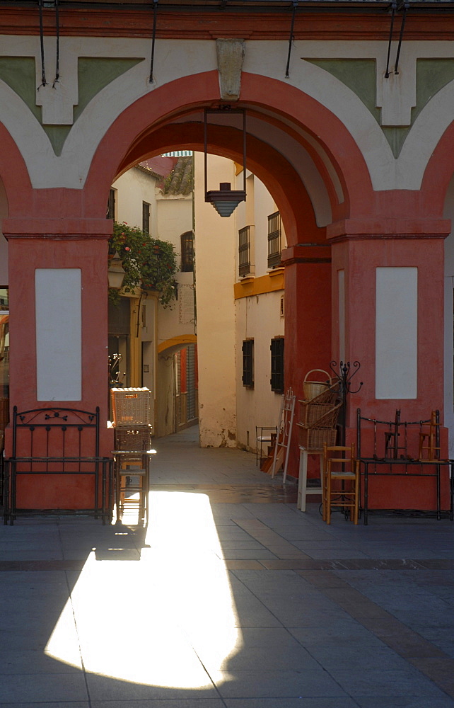 Morning light falling through an arc at Plaza Corredera, Cordoba, Andalusia, Spain, Europe