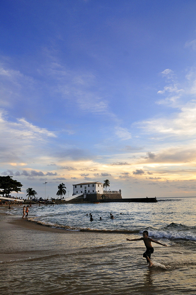 Sunset on the beach of Porto da Barra and Forte Santa Maria fortress, Salvador, Bahia, Brazil, South America