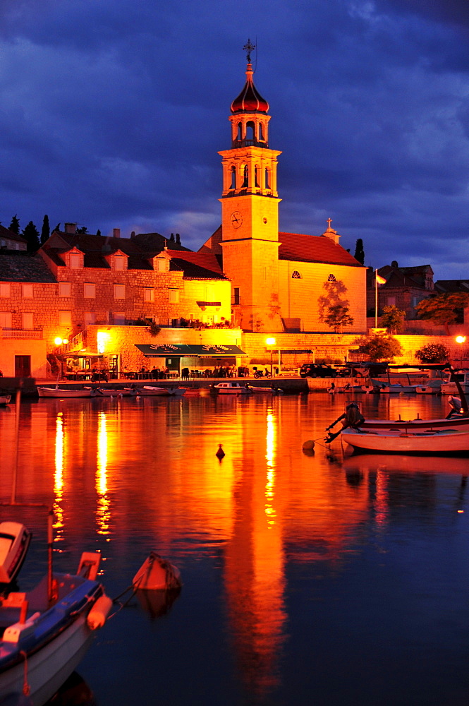 Fishing boats in the harbor of Sutivan in front of the church Sveti Ivan, Island Brac, Dalmatia, Croatia, Balkans, Europe