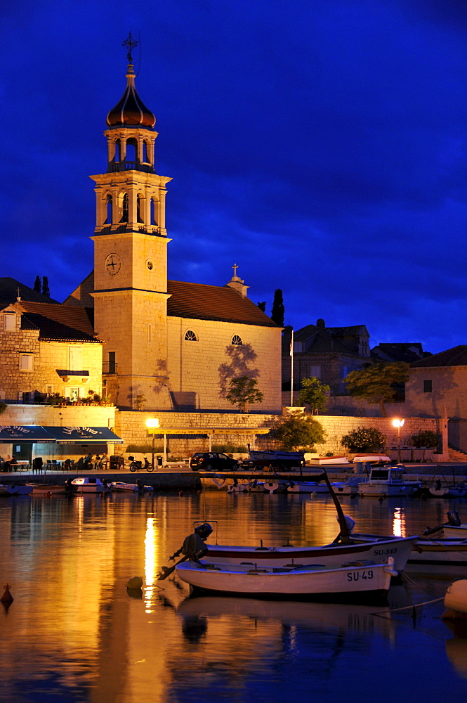 Fishing boats in the harbor of Sutivan in front of the church Sveti Ivan, Island Brac, Dalmatia, Croatia, Balkans, Europe