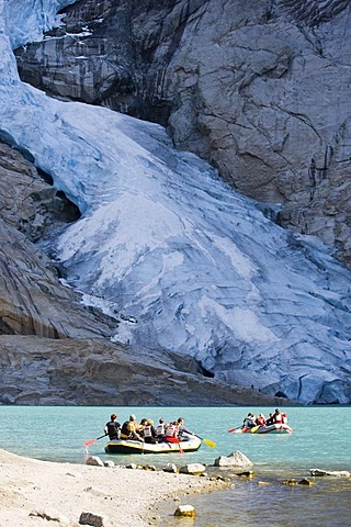 Rubber boat tour on the glacial lake in front of the Briksdalsbreen glacier, Norway, Scandinavia, Europe