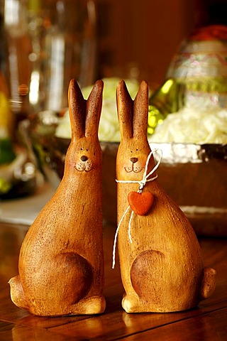 Easter decoration, two clay Easter bunnies on an Easter table