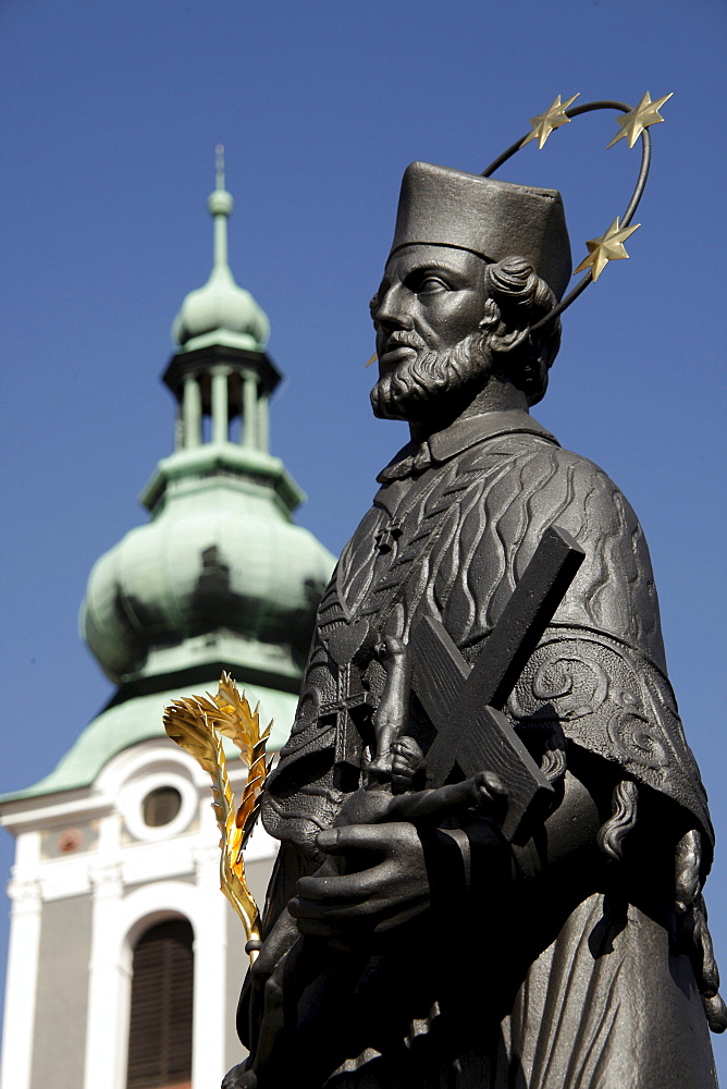 Statue of Saint John of Nepomuk on Lazebnicky Most bridge and St. Jost Church, &eskË Krumlov, Czech Republic, Europe