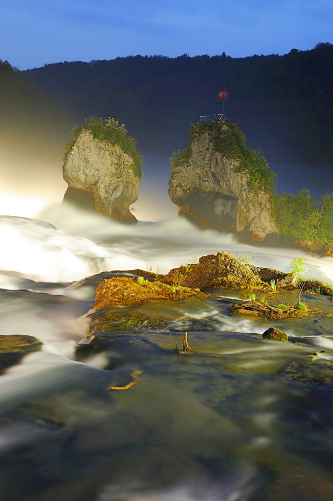 Rhine Falls illuminated by headlights in the evening, Neuhausen, Schaffhausen, Switzerland, Europe