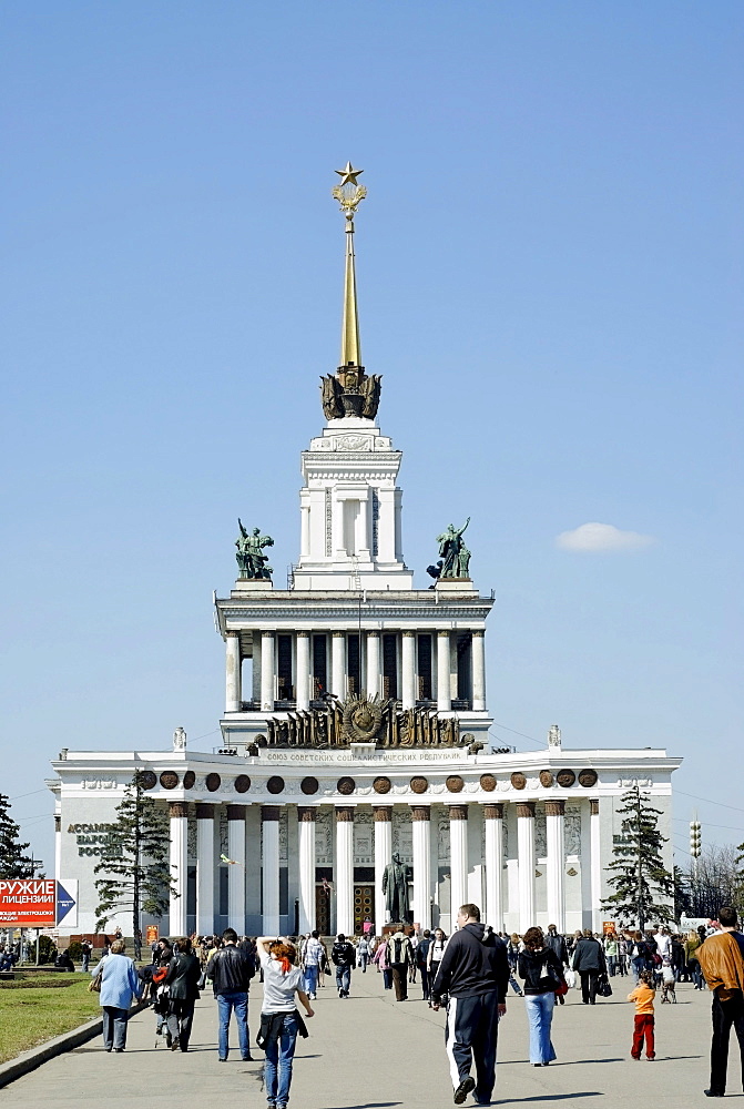 Moscow VVTs or VDNKh, All Russian Exhibition Centre, central pavilion, and many people on a sunny week-end day, Moscow, Russia