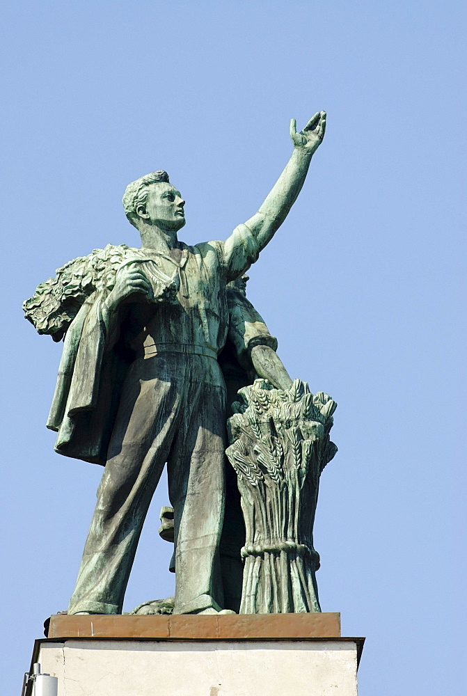 Statue of Soviet worker above the central pavilion of the VVTs or VDNKh, All Russian Exhibition Centre, Moscow, Russia