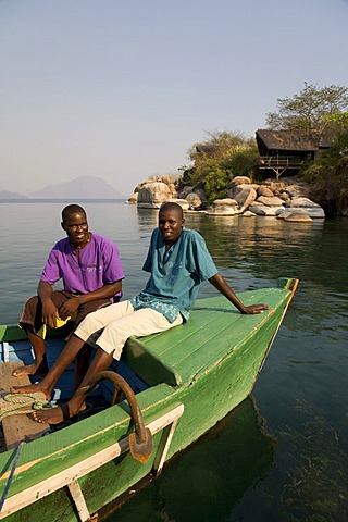 Staff on a boat, Mumbo Island Camp, Cape Maclear Peninsula, Lake Malawi, Malawi, South East Africa