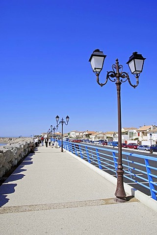 Seafront promenade with lanterns, Les Saintes-Maries-de-la-Mer, Camargue, Bouches-du-Rhone, Provence-Alpes-Cote d'Azur, Southern France, France, Europe