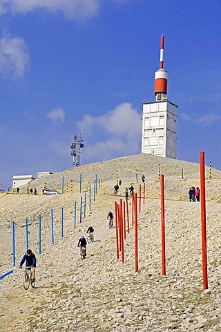 Mountainbikers and tower of the weather station on the peak of Mont Ventoux, Vaucluse, Provence-Alpes-Cote d'Azur, Southern France, Europe