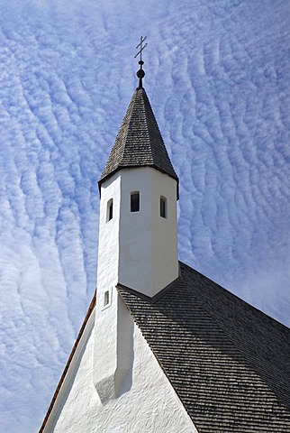 The tower of a small chapel against thin high clouds in Bad Ausee, Styria, Austria, Europe