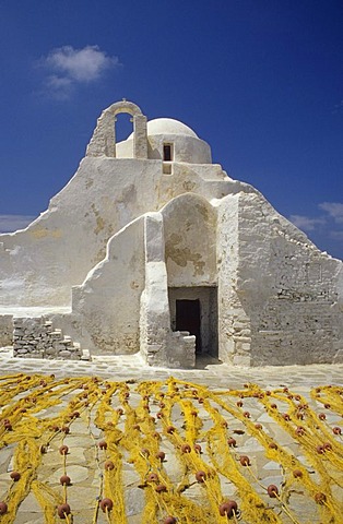 Fishing nets in front of the Paraportiani church in Mykonos City, Mykonos Island, Greece, Europe